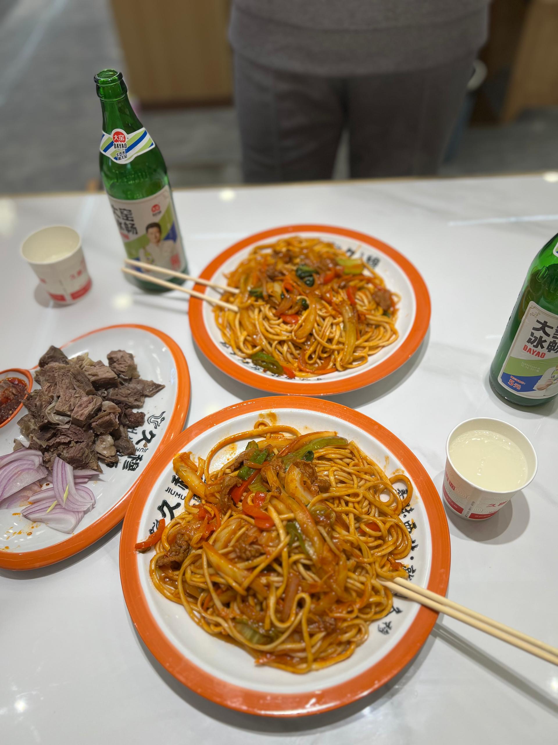 Traditional noodles and side dishes served in a campus restaurant