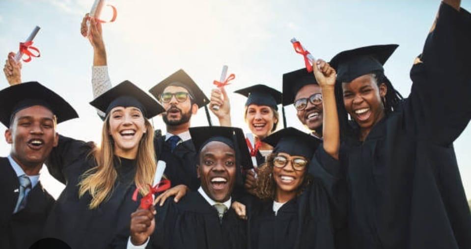 Group of graduates celebrating scholarship success