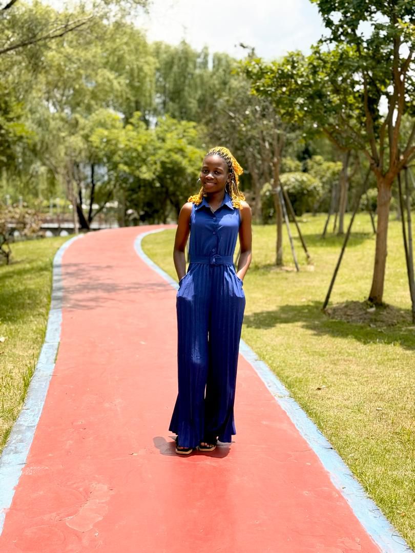 Students standing on campus with academic buildings in the background